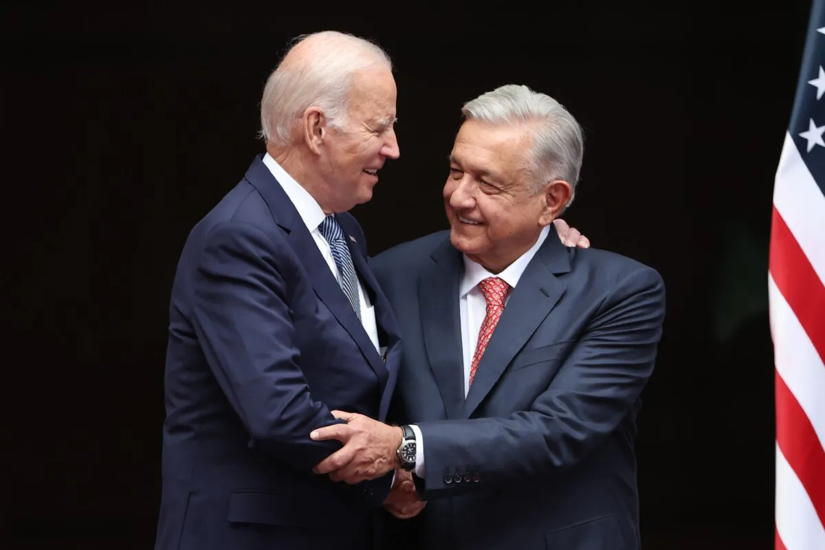 U.S. President Joe Biden (L) and Mexican President Andrés Manuel López Obrador hug during a welcome ceremony as part of the 2023 North American Leaders Summit at Palacio Nacional in Mexico City on Jan. 9, 2023. (Hector Vivas/Getty Images)