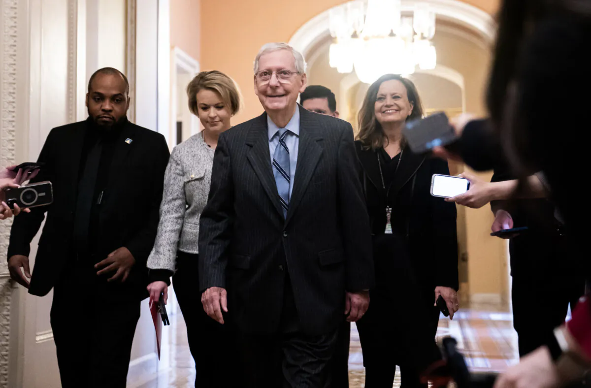 Senate Minority Leader Mitch McConnell (R-Ky.) walks into the Senate chamber in Washington on Feb. 28, 2024. (Nathan Howard/Getty Images)
