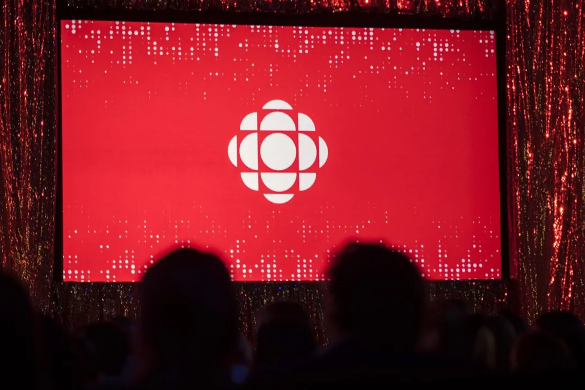 The CBC logo is projected onto a screen in Toronto on May 29, 2019. (The Canadian Press/Tijana Martin)
