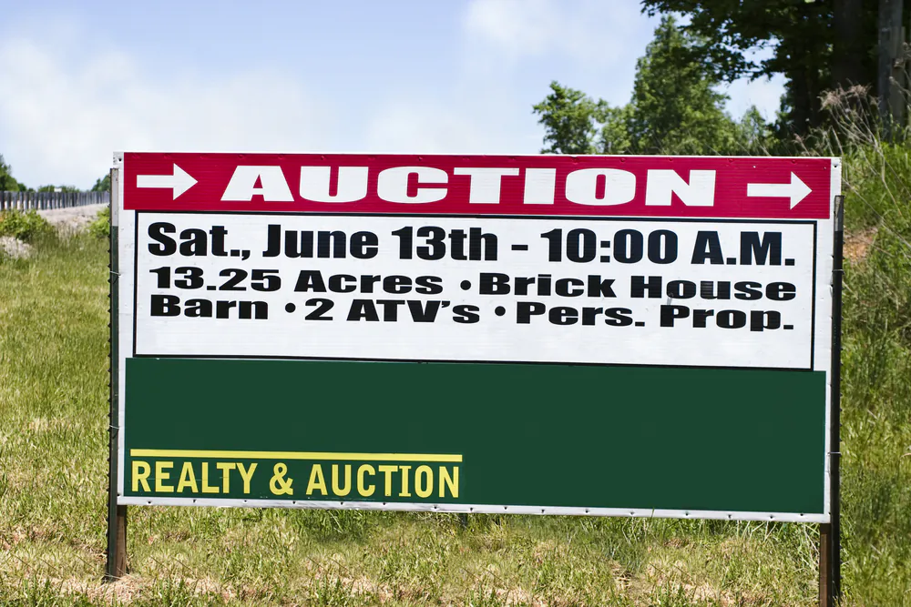 Real Estate Auction Sign for a family farm on Dec. 30, 2023.. 

