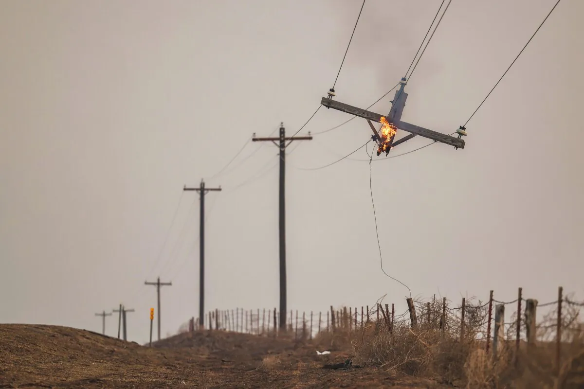 A telephone pole burns from the Smokehouse Creek fire, in Canadian, Texas, on Feb. 28, 2024. (David Erickson/AP Photo)