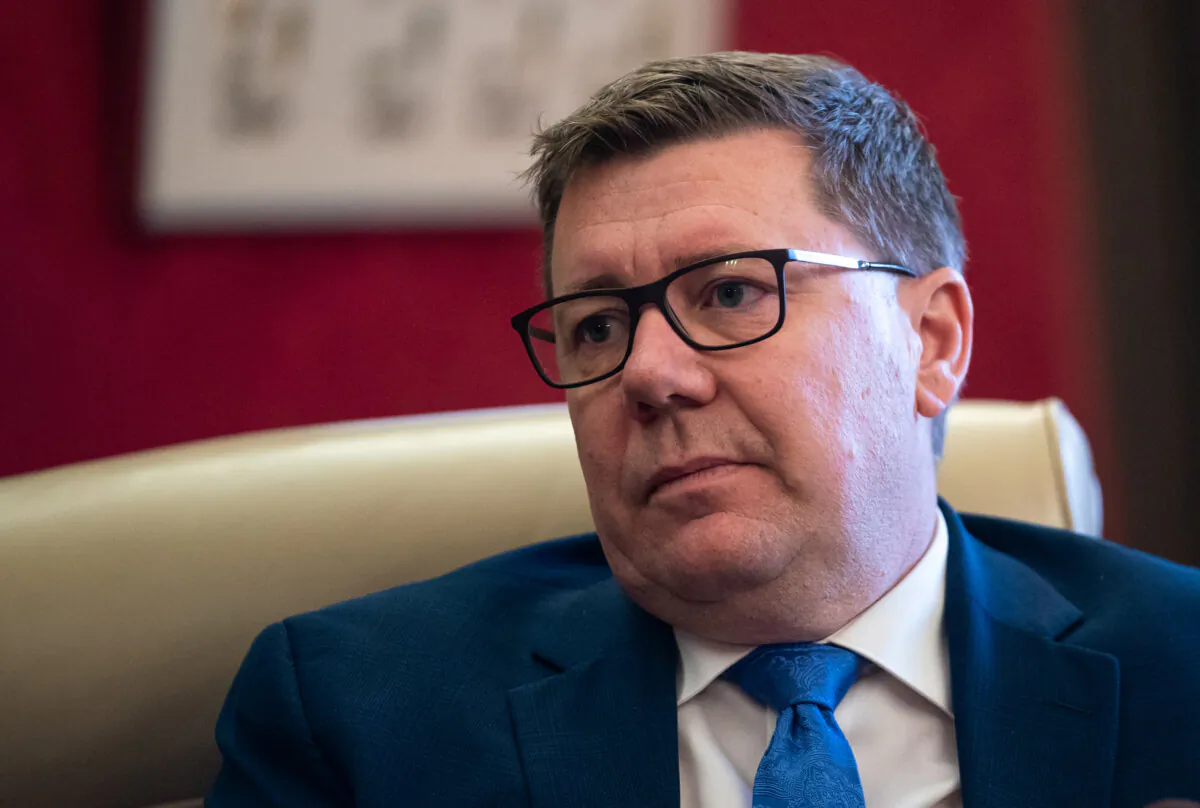 Saskatchewan Premier Scott Moe looks on during an interview in the cabinet room at the Saskatchewan Legislative Building in Regina, on Dec. 18, 2023. (The Canadian Press/Heywood Yu)