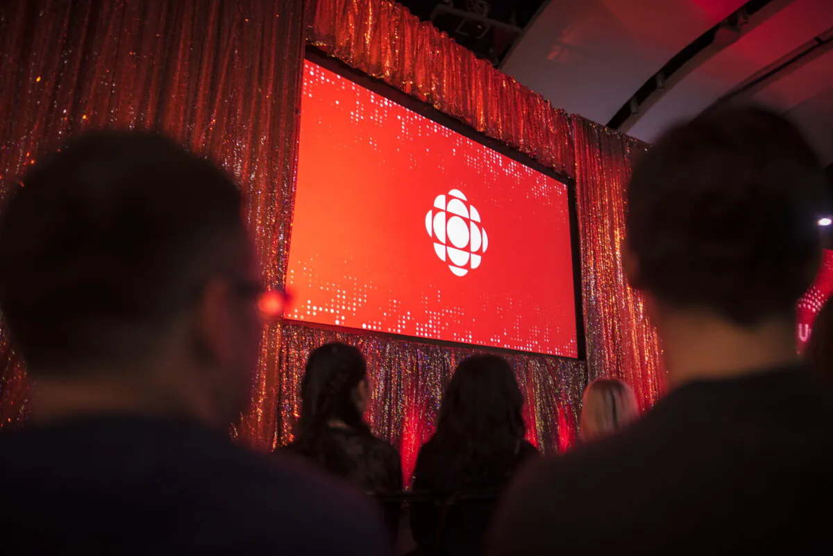 The CBC logo is projected onto a screen during the CBC's annual upfront presentation at The Mattamy Athletic Centre in Toronto, on May 29, 2019. (The Canadian Press/Tijana Martin)