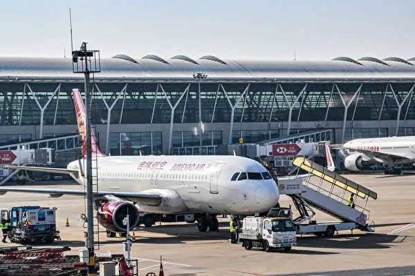 A Juneyao Air plane is seen at the Shanghai Pudong International Airport in Shanghai on Feb. 12 2024. (Photo by Hector Retamal / AFP)