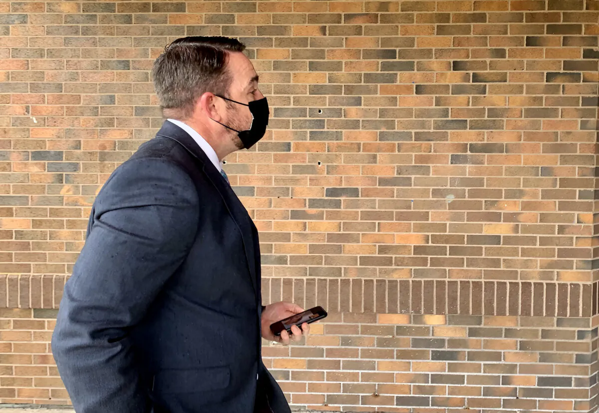 Royal Newfoundland Constabulary Const. Carl Douglas Snelgrove arrives at the provincial Supreme Court building in St. John's on May 15, 2021. (The Canadian Press/Sarah Smellie)