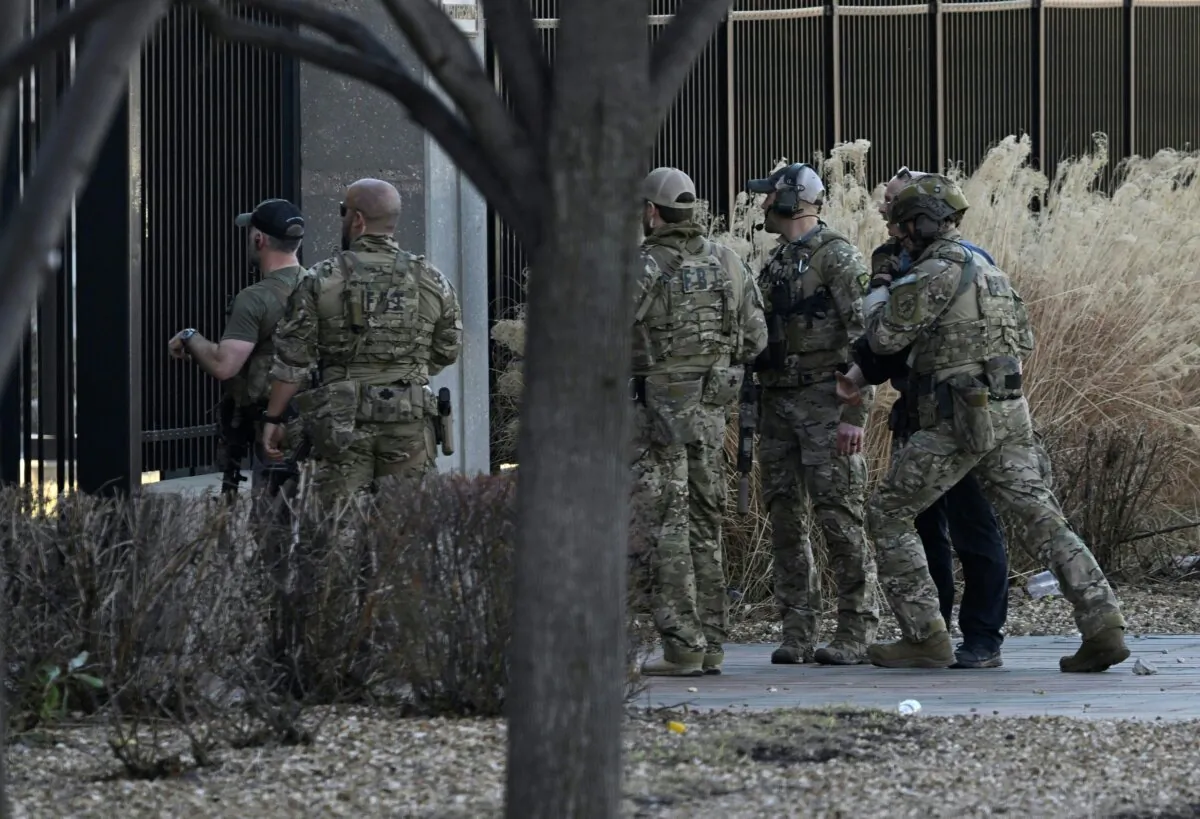 Police respond to an active shooter after shots were fired near the Kansas City Chiefs' Super Bowl LVIII victory parade in Kansas City, Mo., on Feb. 14, 2024. (Andrew Caballero-Reynolds/AFP via Getty Images)