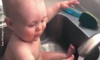 An adorable baby has the funniest bath time with dad