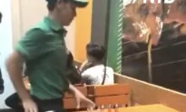 Waiter Cleans and Sets Table With Flair