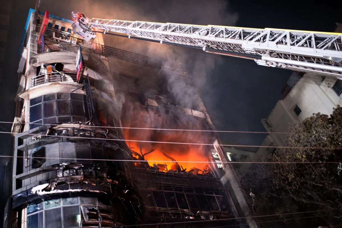 Firefighters work to contain a fire that broke out at a commercial complex in Dhaka, Bangladesh, on Feb. 29, 2024. (Mahmud Hossain Opu/AP Photo)