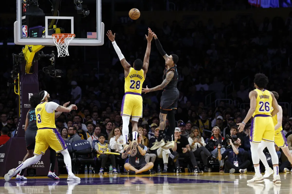 Kyle Kuzma (33) of the Washington Wizards scores a basket on a hook shot against Rui Hachimura (28) of the Los Angeles Lakers during the second half against the Los Angeles Lakers in Los Angeles on Feb. 29, 2024. (Kevork Djansezian/Getty Images)