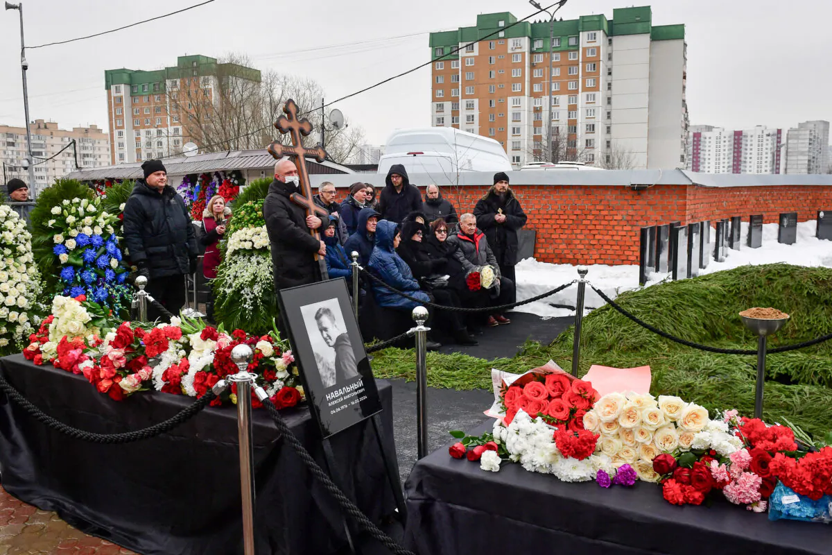 Lyudmila Navalnaya (3rd R front) and Anatoly Navalny (2nd R front), parents of late Russian opposition leader Alexei Navalny, attend a funeral ceremony for their son at the Borisovskoye Cemetery in Moscow on March 1, 2024. (Olga Maltseva/AFP via Getty Images)