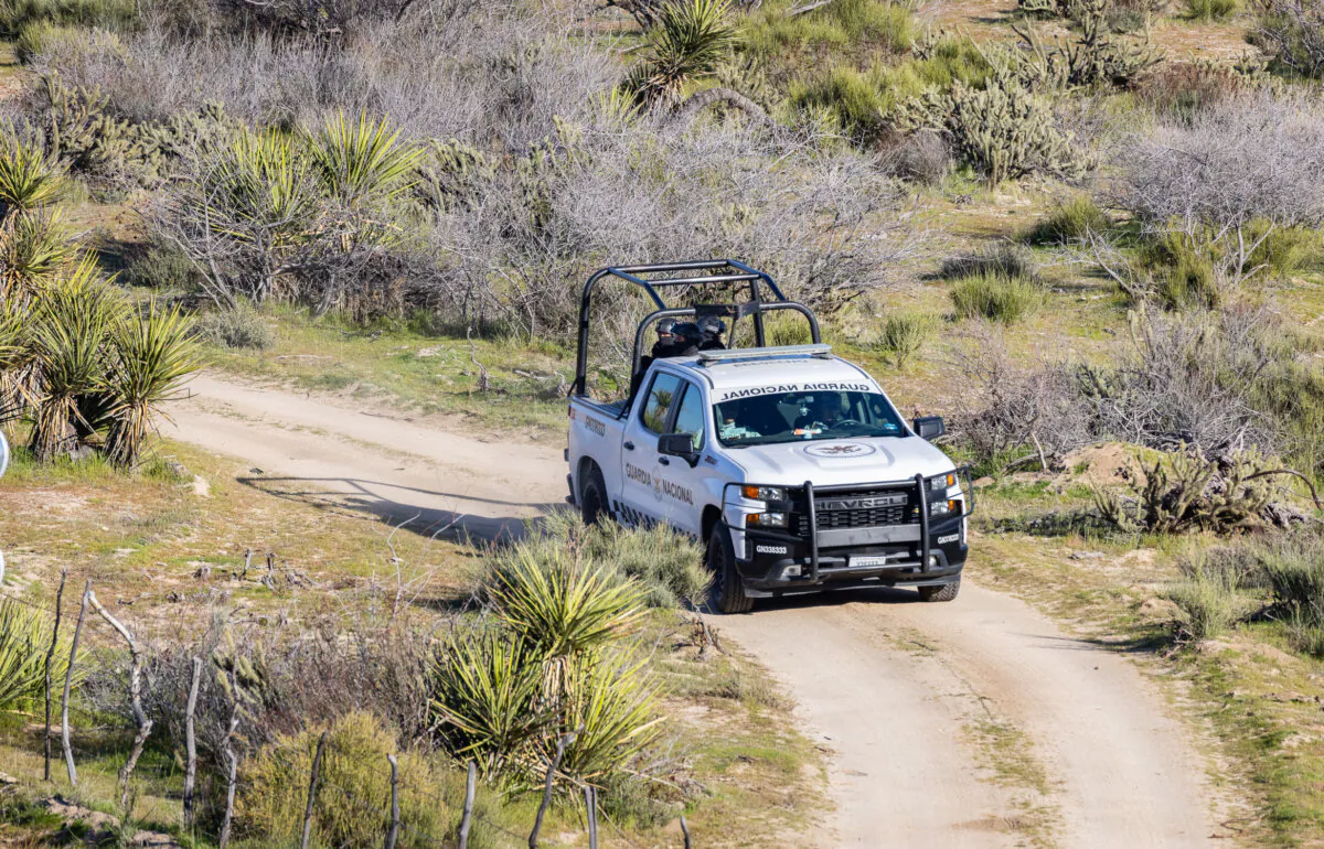 Guardia Nacional troops patrol the Mexican side of the U.S. border seen from Jacumba, Calif., on Feb. 29. (John Fredricks/The Epoch Times)