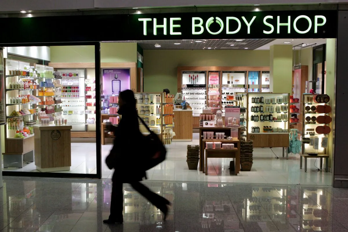 A woman passes a Body Shop cosmetics store at the airport in Frankfurt, central Germany, on March 17, 2006. (The Canadian Press/AP-Michael Probst)