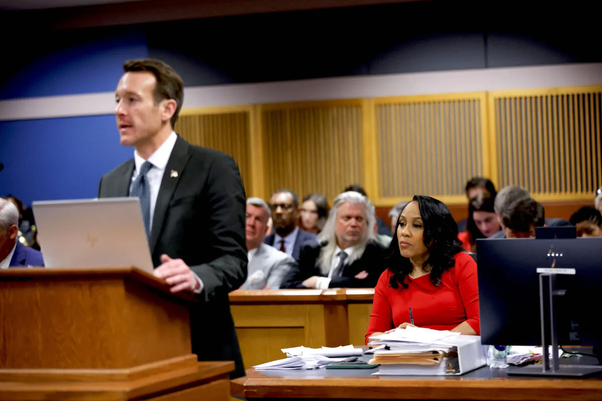 Attorney Adam Abbate speaks with Fulton County District Attorney Fani Willis looking on during the final arguments in her disqualification hearing at the Fulton County Courthouse in Atlanta, Ga., on March 1, 2024. (Alex Slitz/Pool/AFP via Getty Images)