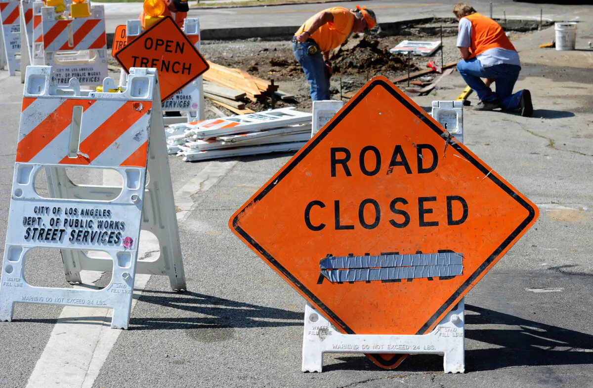City of Los Angeles Public Works Department Street Services workers repair a sidewalk in Los Angeles on Aug. 12, 2010. (Kevork Djansezian/Getty Images)