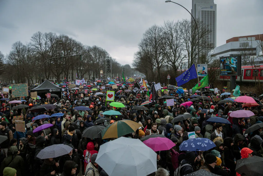 People demonstrate against the right-wing party Alternative for Germany (AfD) in Hamburg, on Feb. 25, 2024. (Hami Roshan/Middle East Images/AFP via Getty Images)