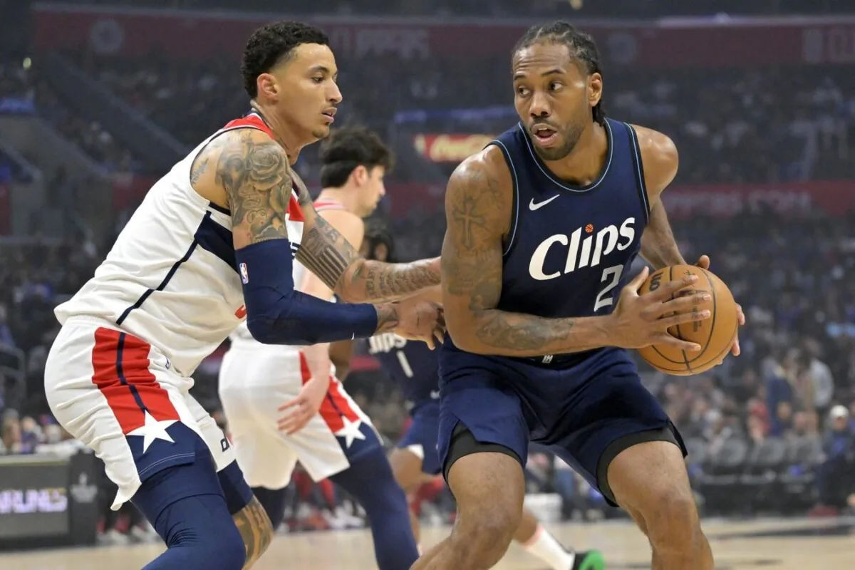 Los Angeles Clippers forward Kawhi Leonard (2) is defended by Washington Wizards forward Kyle Kuzma (33) in the first half in Los Angeles on March 1, 2024. (Jayne Kamin-Oncea/USA TODAY Sports via Field Level Media)