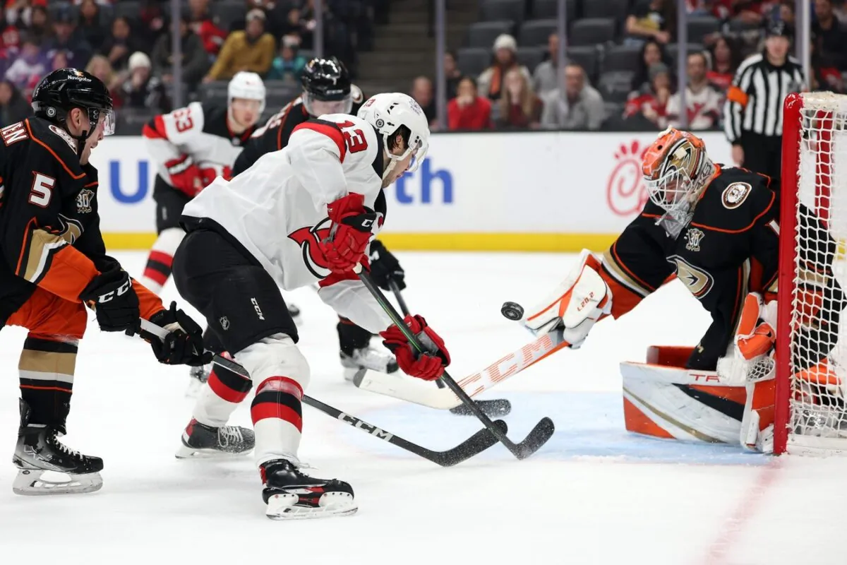Anaheim Ducks goaltender Lukas Dostal (1) defends a shot from New Jersey Devils center Nico Hischier (13) during the first period in Anaheim, Calif., on March 1, 2024. (Kiyoshi Mio-USA TODAY Sports via Field Level Media)