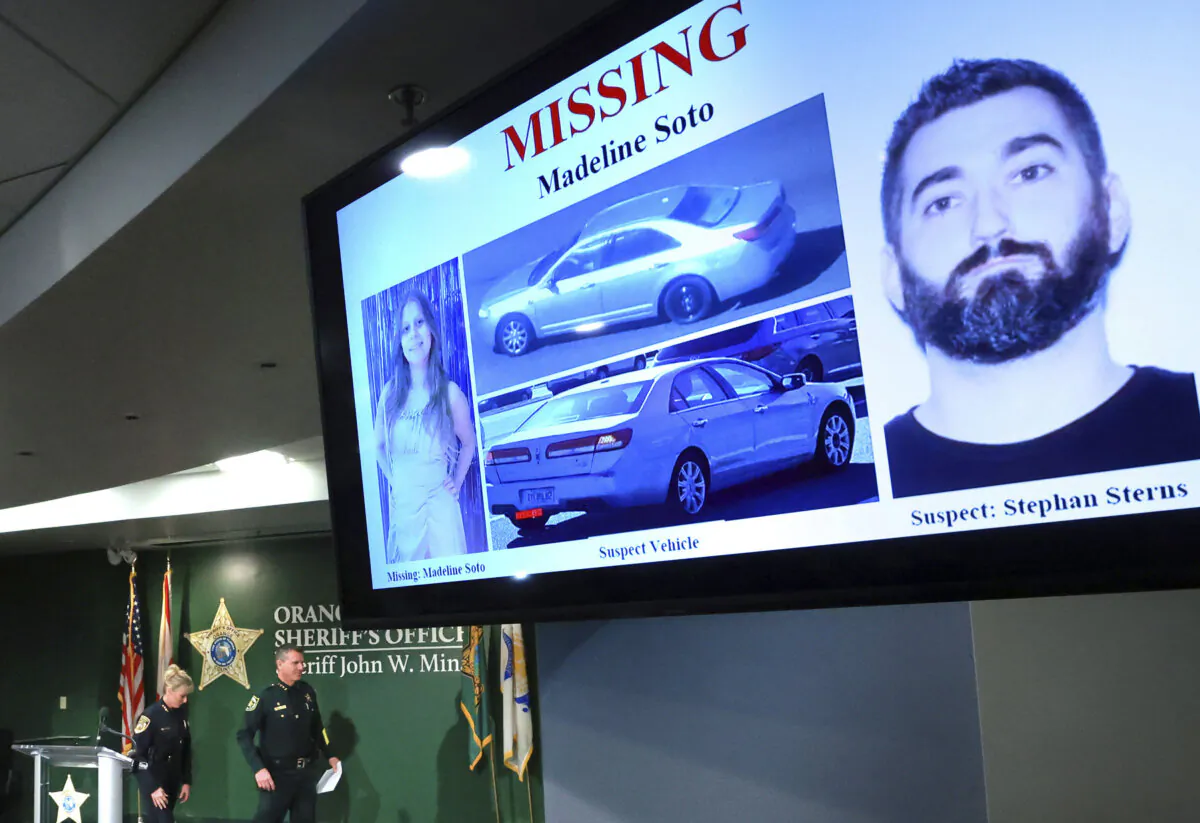 A missing persons flyer for 13-year-old Madeline Soto and primary suspect Stephan Sterns, far right, on display as Orange County Sheriff John Mina and Kissimmee Police Chief Betty Holland depart from a press conference at OCSO headquarters in Orlando, Friday, March 1, 2024, after announcing that their investigation has led them to believe that Soto was killed by Sterns. (Joe Burbank/Orlando Sentinel via AP)
