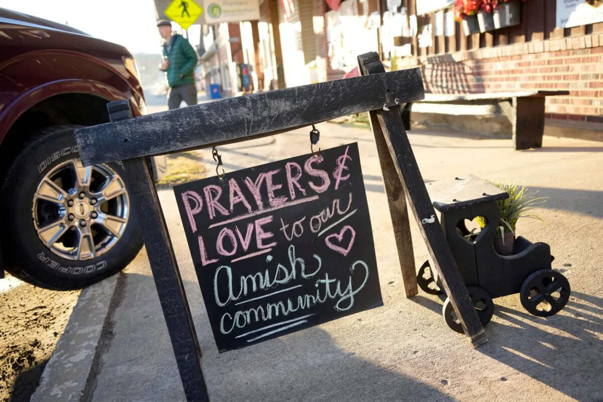 A sign on the sidewalk outside an antique store in Spartansburg, Pa., on Thursday, Feb. 29, 2024. Shawn C. Cranston was arrested Saturday, March 2, and charged with the slaying of a pregnant Amish woman whose body was found last week. (AP Photo/Gene J. Puskar)