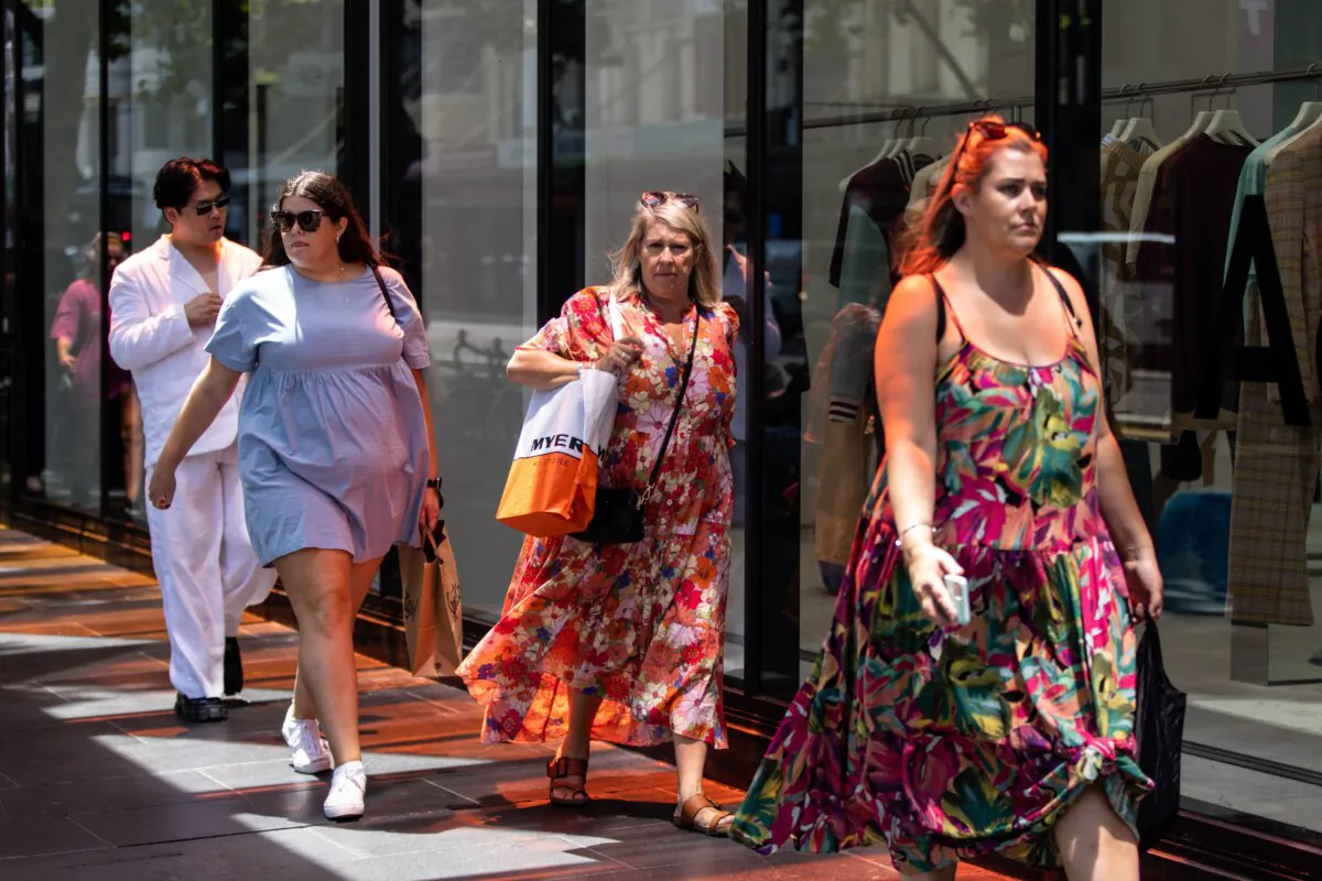 People walk along Elizabeth Street in Melbourne, Australia, on Jan. 25, 2023. (AAP Image/Diego Fedele)