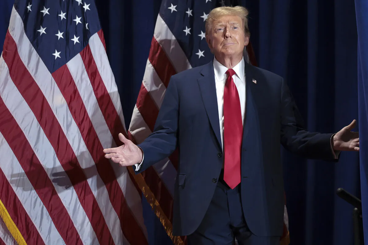 Republican presidential candidate and former President Donald Trump reacts to supporters while arriving on stage during a Get Out the Vote Rally in Richmond, Va. on March 2, 2024. (Win McNamee/Getty Images)