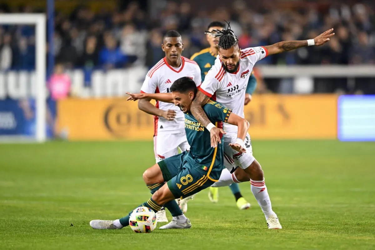 San Jose Earthquakes forward Will Richmond (20) battles for the ball against LA Galaxy midfielder Mark Delgado (8) during the first half in San Jose on March 2, 2024. (Robert Edwards/USA TODAY Sports via Field Level Media)