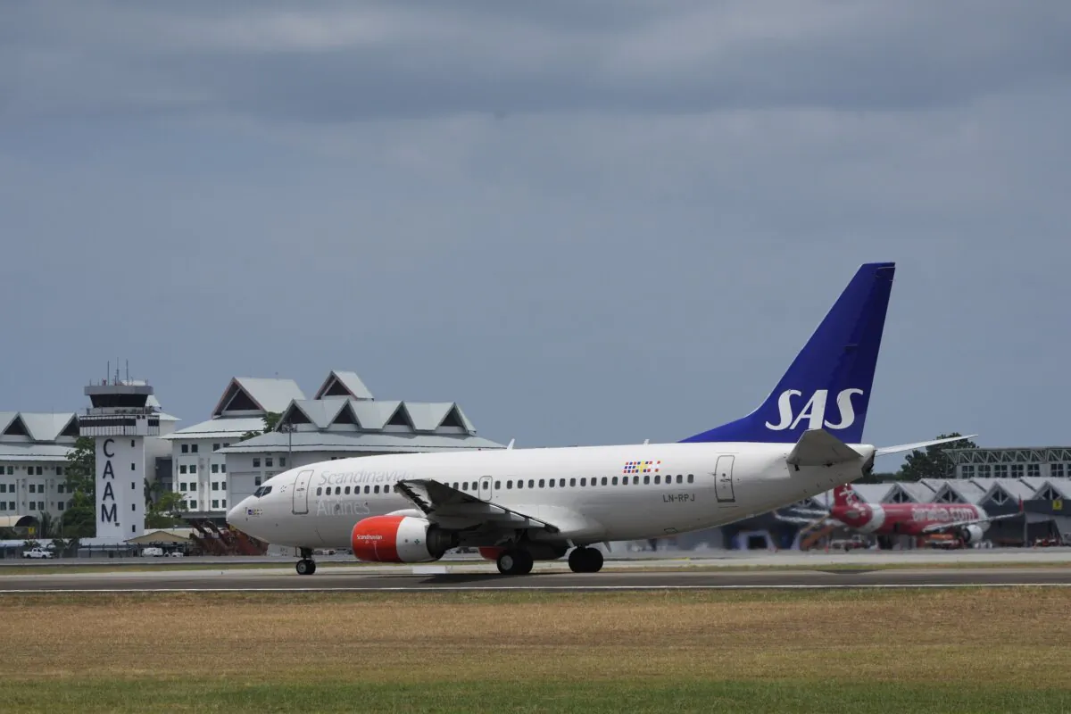 A Scandinavian Airlines medevac plane, believed to be carrying Norway's King Harald, is seen at Langkawi international airport on the Malaysian resort island of Langkawi, Malaysia, on March 3, 2024. (Vincent Thian/AP Photo)