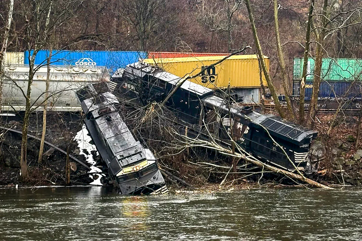 This photo provided by Nancy Run Fire Company shows a train derailment along a riverbank in Saucon Township, Pa., on Saturday, March 2, 2024. Authorities said it was unclear how many cars were involved but no injuries or hazardous materials were reported. (Nancy Run Fire Company via AP)