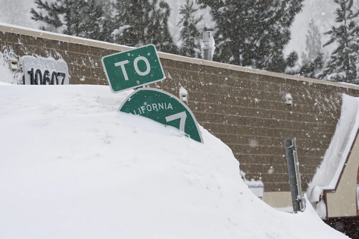 A highway sign is covered in snow during a storm in Truckee, Calif., on March 3, 2024. (Brooke Hess-Homeier/AP Photo)