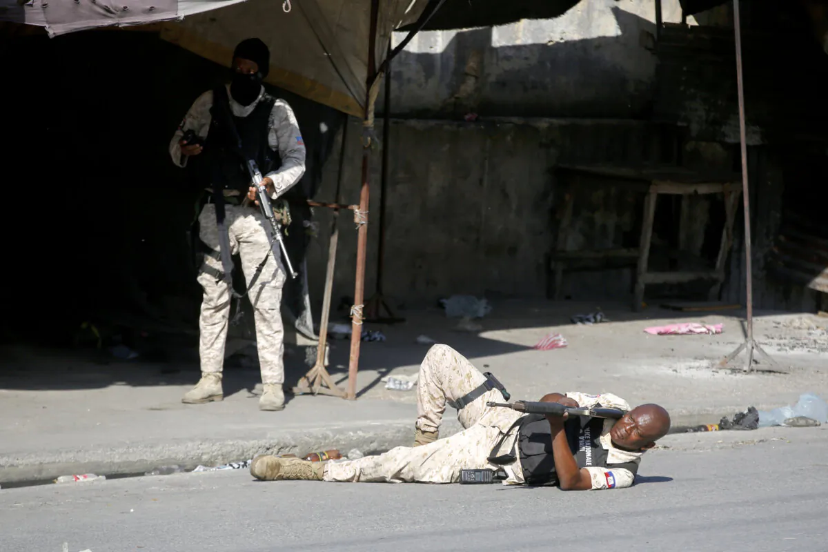 A police aims during clashes with gang members in Port-au-Prince, Haiti, on March 1, 2024. (Odelyn Joseph/AP Photo)