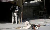 Hundreds of Inmates Flee After Armed Gangs Storm Haiti’s Main Prison, Leaving Bodies Behind