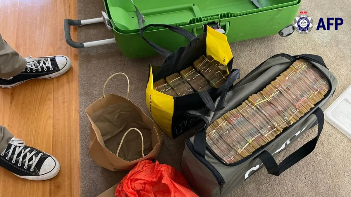 An image of some of the $2.3 million in cash and cryptocurrency seized by Australian Federal Police when the searched a property in Hope Island, Queensland, in 2022. (Courtesy of Qld Police)