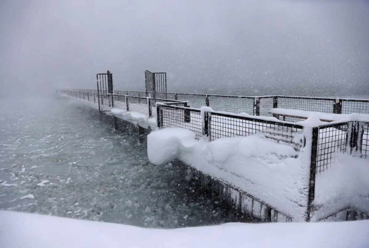 Snow continues to fall on the shores of Lake Tahoe in Tahoe City, Calif., on March 2, 2024. (Jane Tyska/Bay Area News Group via AP)