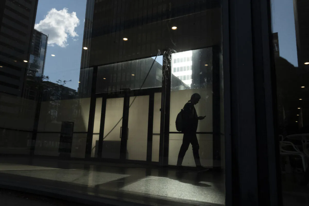 A man walks though a downtown Toronto office building in a June 11, 2019 photo. (The Canadian Press/Graeme Roy)