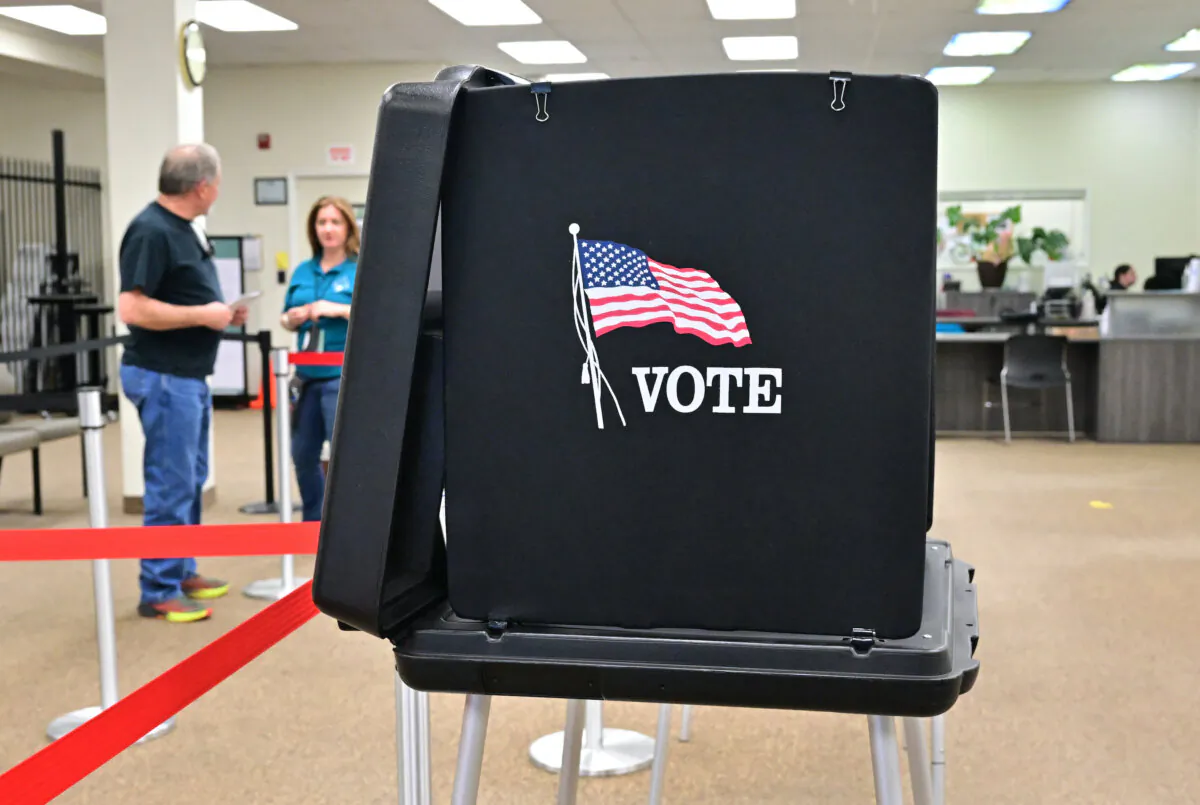 People arrive to cast their ballots at the Shasta County Clerk Registrar of Voters offices in Redding, Calif., on Feb. 23, 2024. In this week's "Super Tuesday" primaries, security guards will monitor the back door at one Shasta County polling precinct—a sign of political tensions in rural northern California. (Frederic J. Brown/AFP via Getty Images)
