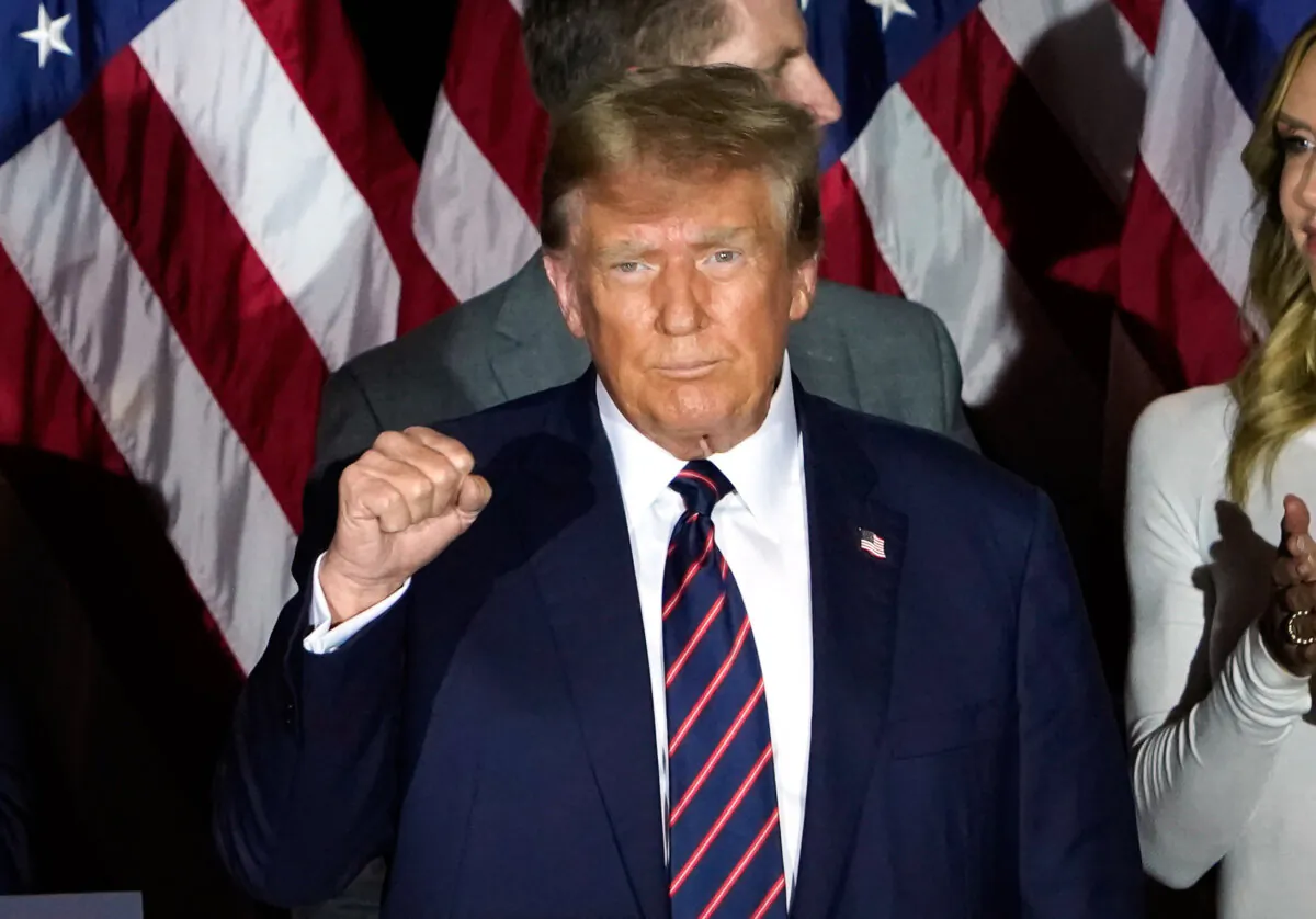 Republican presidential hopeful and former President Donald Trump gestures during an Election Night Party in Nashua, N.H., on Jan. 23, 2024. (Timothy A. Clary/AFP via Getty Images)