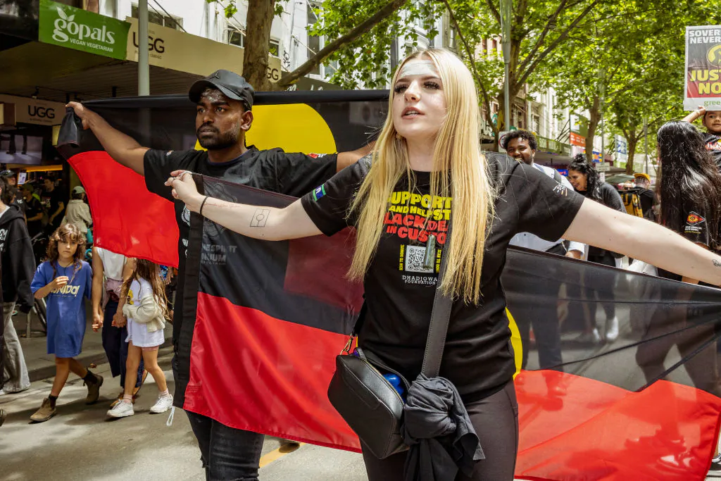 An Aboriginal man and woman march during the Invasion Day Rally in Melbourne, Australia on Jan. 26, 2024. (Tamati Smith/Getty Images)