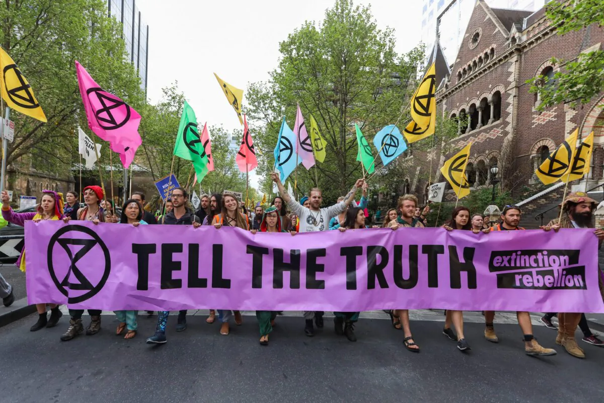 Demonstrators march on a street during a Extinction Rebellion protest in Melbourne, Australia, on Oct. 7, 2019. (Asanka Brendon Ratnayake/AFP via Getty Images)