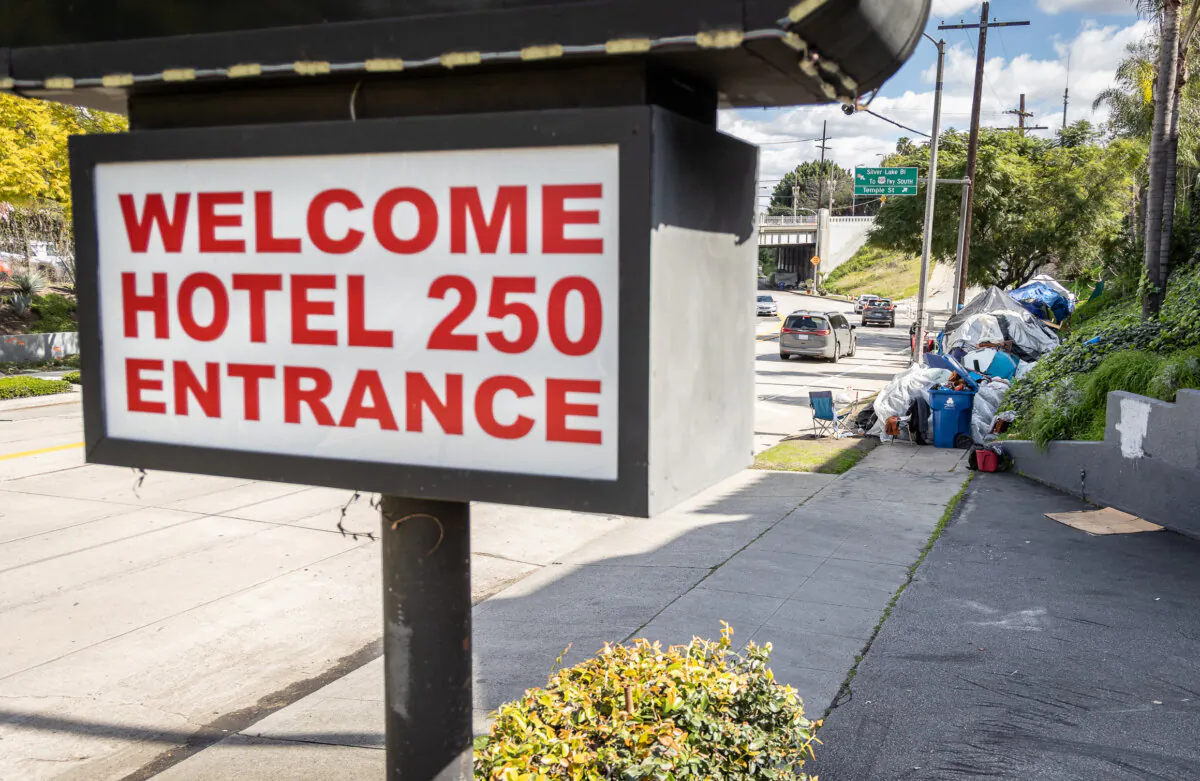 A homeless encampment sits in front of an Inside Safe site in Los Angeles on March 4, 2024. (John Fredricks/The Epoch Times)