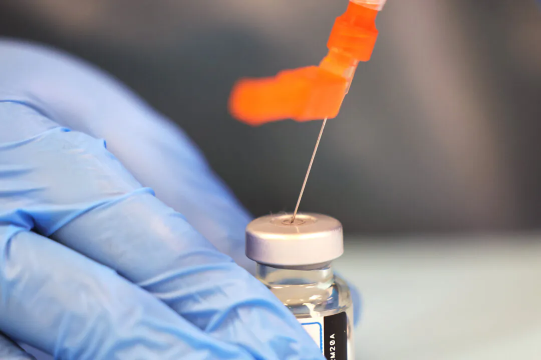A health care worker prepares a COVID-19 vaccine in New York City in a file photograph. (Michael M. Santiago/Getty Images)