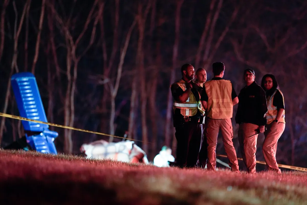 Emergency officials work the scene of a fatal small plane crash alongside Interstate 40 near mile marker 202 in Nashville, Tenn., on March 4, 2024. (George Walker IV/AP Photo)