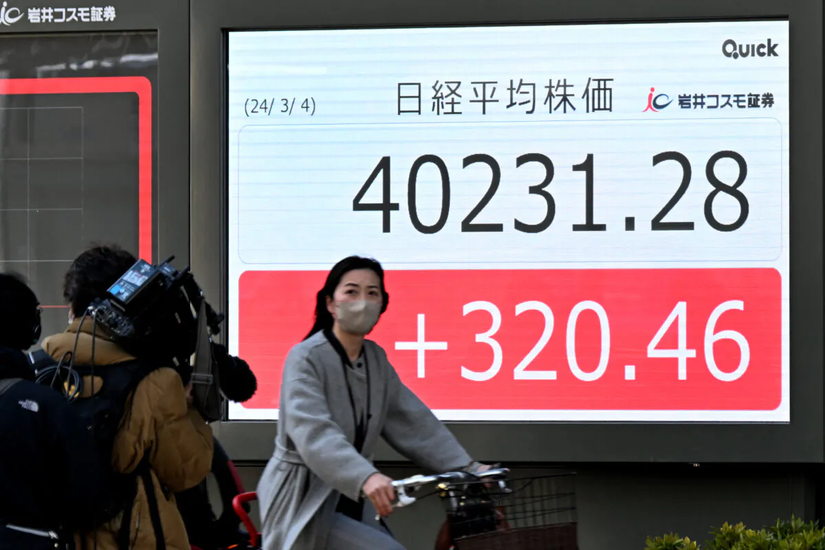 An electronic board displays a share price of the Nikkei index of the Tokyo Stock Exchange in Tokyo, on March 4, 2024. (Kazuhiro Nogi/ AFP via Getty Images)
