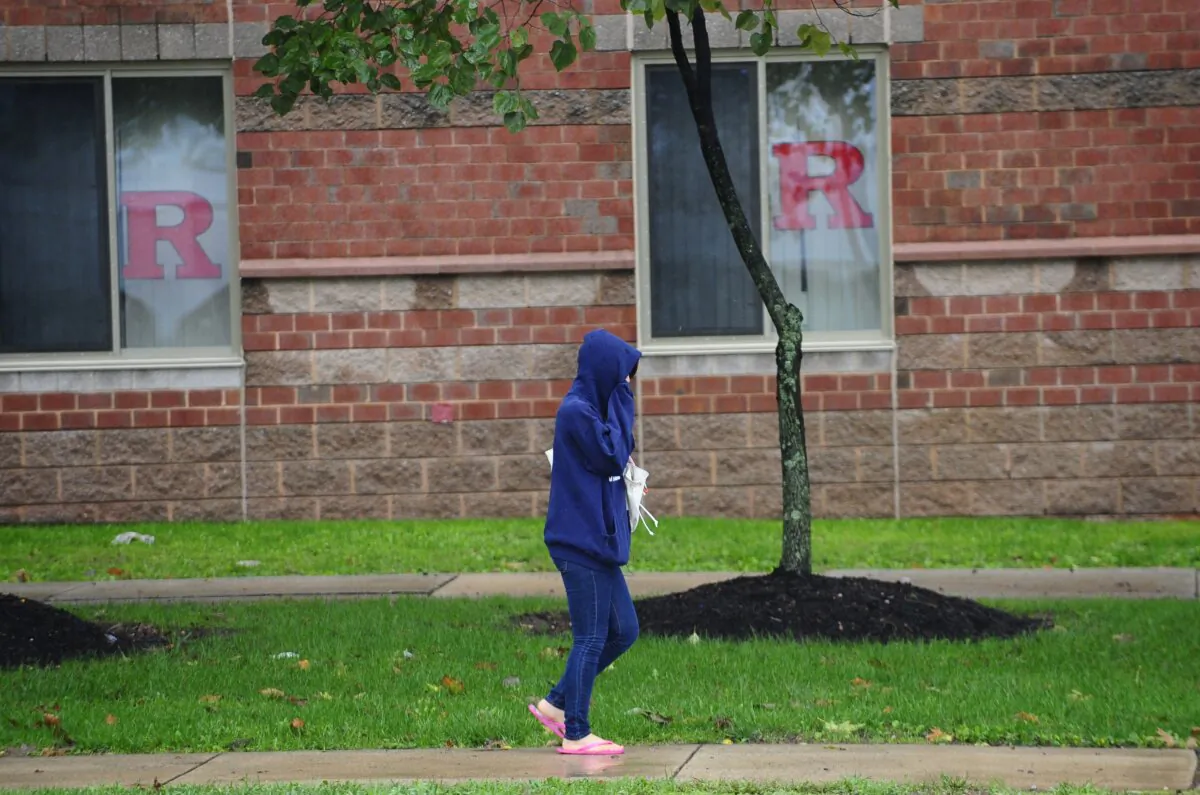 A student walks past the dormitory at Rutgers Univeristy in New Brunswick, N.J., on Oct. 1, 2010. (Emmanuel Dunand/AFP via Getty Images)