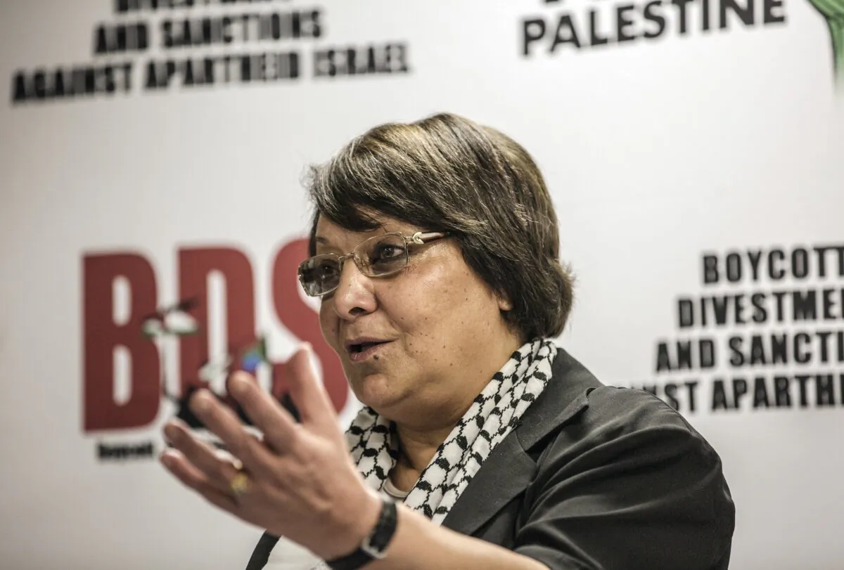 Leila Khaled of Palestinian Liberation Front attends a press conference upon her arrival at the O.R. Tambo international Airport, in Johannesburg, on Feb. 6, 2015. (Gianluigi Guercia/AFP via Getty Images)