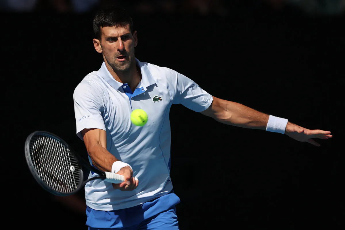 Novak Djokovic of Serbia plays a forehand in a match against Jannik Sinner of Italy during the 2024 Australian Open at Melbourne Park in Melbourne, Australia, Jan. 26, 2024. (Daniel Pockett/Getty Images)