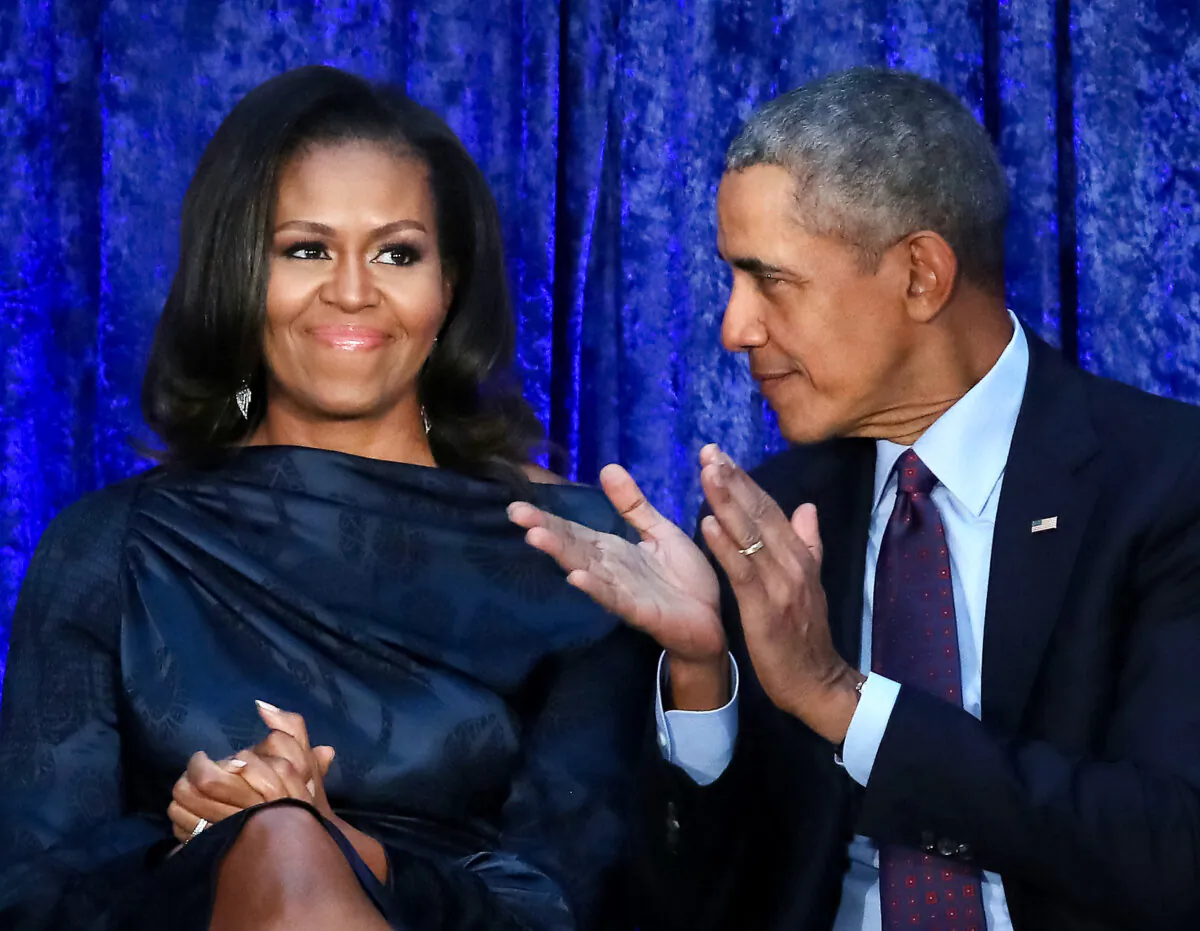 Former U.S. President Barack Obama and first lady Michelle Obama participate in the unveiling of their official portraits during a ceremony at the Smithsonian's National Portrait Gallery in Washington on Feb. 12, 2018. (Mark Wilson/Getty Images)