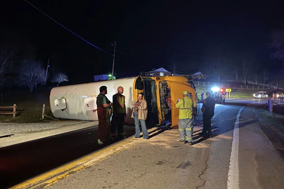 Emergency personnel respond to the scene of a bus crash on Monday, March 4,2024 on West Virginia Route 16 in Calhoun County. The bus driver was arrested Monday for driving under the influence after a crash that sent multiple injured students to the hospital, state police said.(WCHS TV)