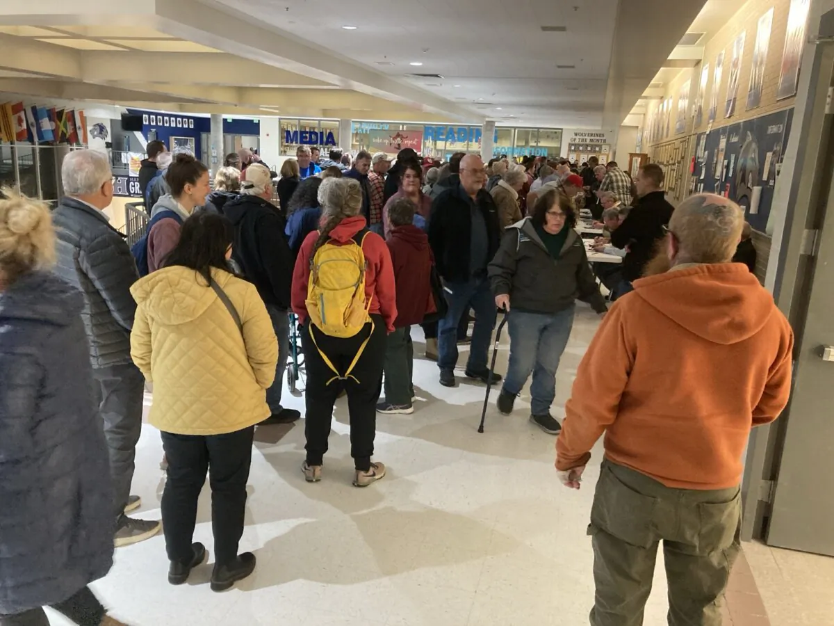 Voters wait during a website glitch to have their Republican Party registrations verified as GOP presidential preference caucuses nevertheless kick off at Hunter High School in West Valley City, south of Salt Lake City, on Super Tuesday. (John Haughey/The Epoch Times)