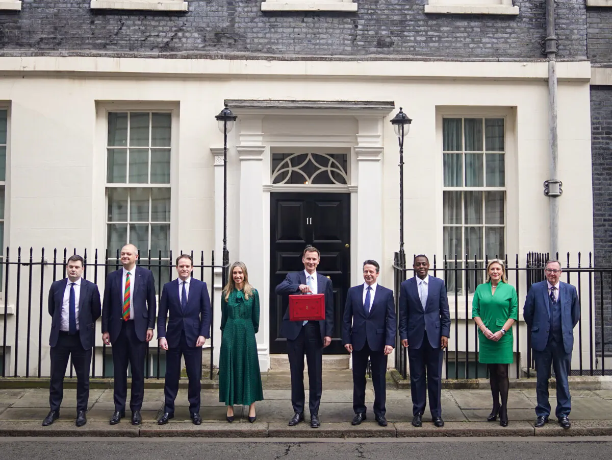 Chancellor of the Exchequer Jeremy Hunt (C, holding red ministerial box) leaves Downing Street, before delivering his Budget in the Houses of Parliament in London on March 6, 2024. (James Manning/PA Wire)